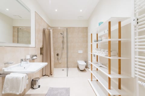 Rainfall showerhead, eco-friendly toiletries, hair dryer, towels