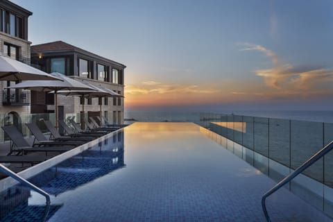Seasonal outdoor pool, pool umbrellas, sun loungers
