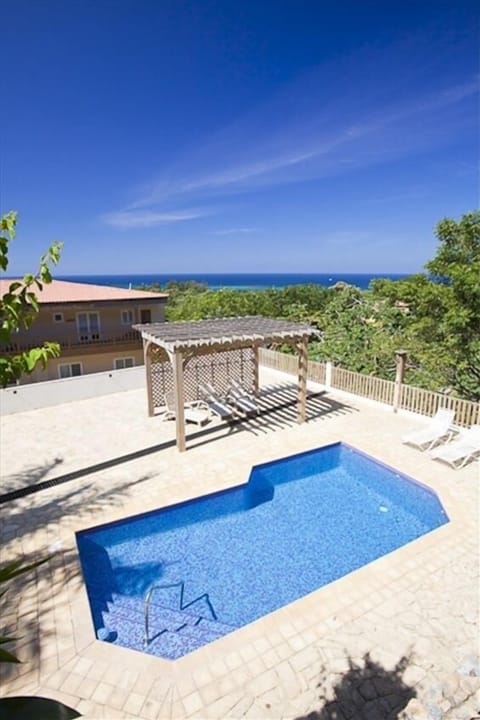 View of the turquoise Caribbean reef and the newly surfaced pool on the balcony