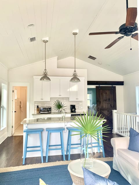 Upper level wet bar with counter seating for four. 