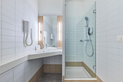 Shower, eco-friendly toiletries, hair dryer, towels