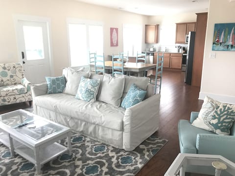 Living room, dining and kitchen. Laundry room to the right of the kitchen.