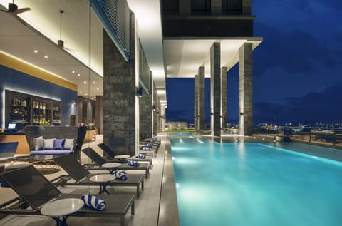 Outdoor pool, open 6:00 AM to 10:00 PM, sun loungers, lifeguards on site