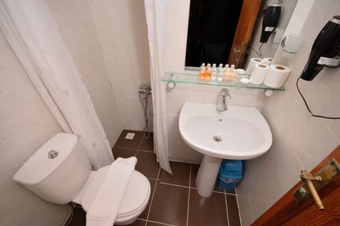 Shower, free toiletries, hair dryer, slippers