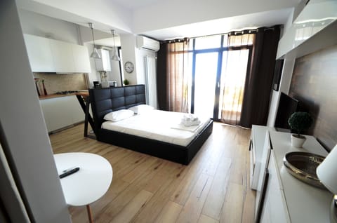 Studio 58 with balcony | Living area | LED TV