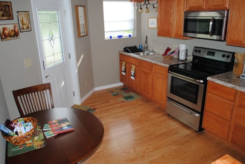 Fully stocked kitchen with breakfast table.