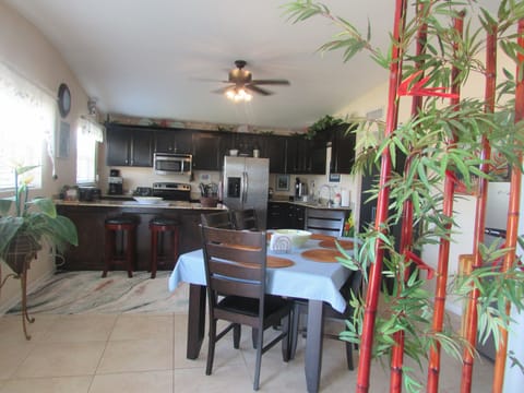Large eat in kitchen for family dining.  Table, 6 chairs and 2 bar stools.