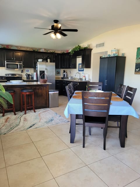 Large eat in kitchen for family dining.  Table, 6 chairs and 2 bar stools.