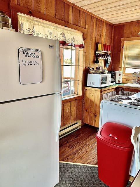 The full size refrigerator and kitchen