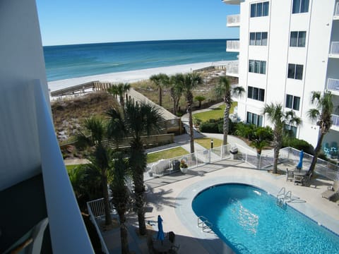 Views of the pool and beach from the balcony.
