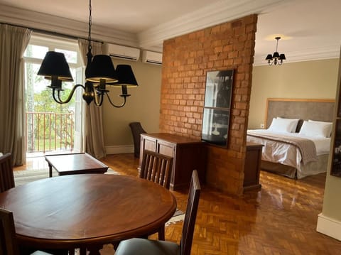 Superior Studio Suite, 1 Bedroom, Garden View | Minibar, in-room safe, laptop workspace, blackout drapes