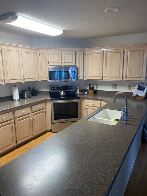 Fully stocked kitchen. You provide food. 