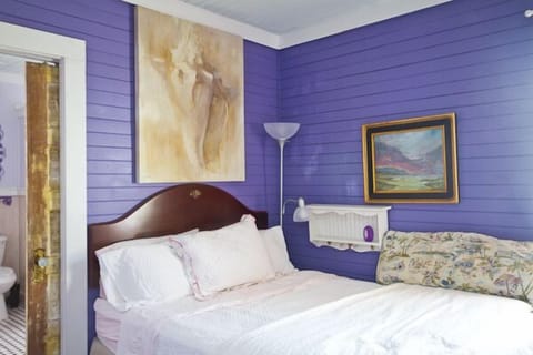 Master bedroom with queen bed and adjoining master bathroom