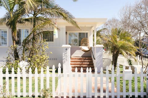 Front of home with swinging chair to enjoy your coffee!