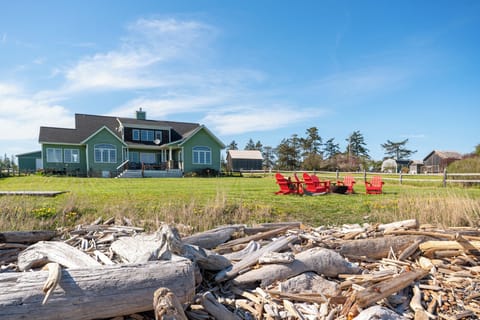 View of the yard, house and firepit from the beach