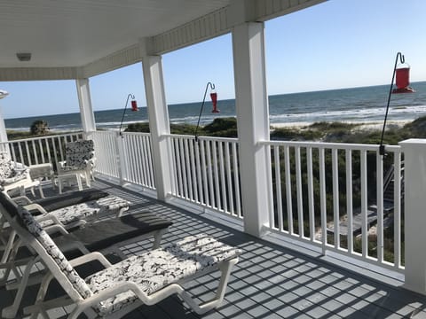 Upper deck with 4 lounge chairs , 4 Adirondack chairs & hummingbird feeders