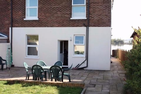 Rear Garden with garden furniture to capture the evening sunshine. 