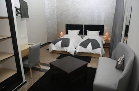 Twin Room | Desk, blackout drapes, soundproofing, cribs/infant beds