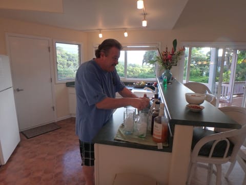 Guest bartending for his family in our spacious kitchen.
