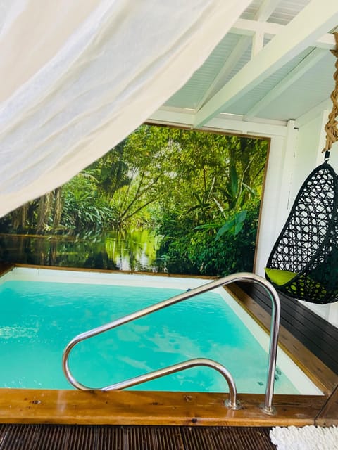 Deluxe Cabin, Accessible, Ensuite (Cabanon Jardin d'Eden) | Hypo-allergenic bedding, minibar, individually decorated, bed sheets
