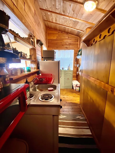 View of kitchen from bedroom entrance