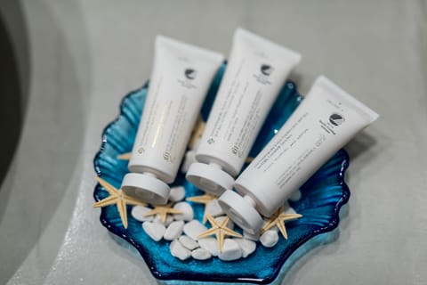 Junior Suite, Heated plunge pool, Sea View | Bathroom amenities | Shower, rainfall showerhead, eco-friendly toiletries, hair dryer