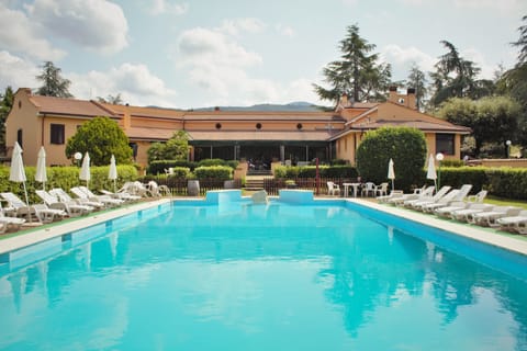 Seasonal outdoor pool, open 10:00 AM to 6:30 PM, pool umbrellas