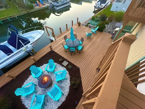 View of the Deck, Dock, Canal, Fire Pit, Grill, Dock Swing from the screened porch