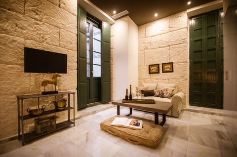 Family Studio, 1 Bedroom, Private Bathroom | Living area | 32-inch flat-screen TV with satellite channels, TV
