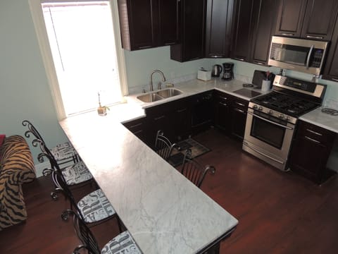 Birdseye view of marble top reclaimed soda bar - now our dining area and kitchen