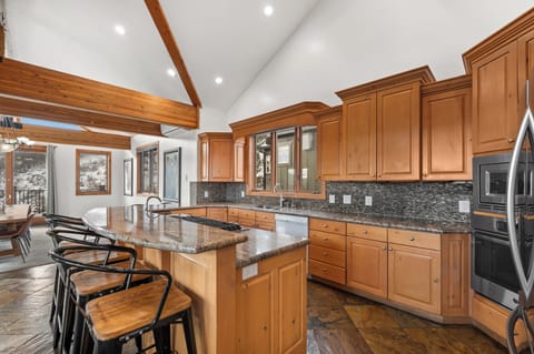 Gourmet kitchen is open to living room and dining