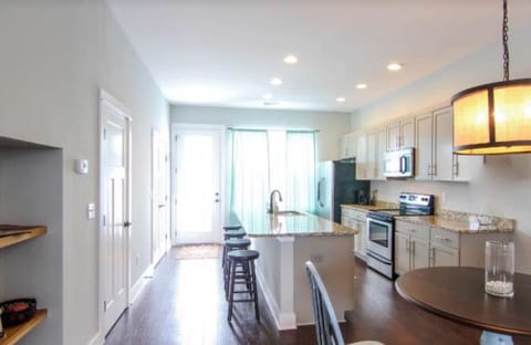 Open Kitchen with Island, Kitchen Table and 4 Stools 