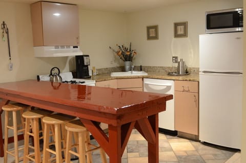 Full kitchen with stove, DW, refrigerator and microwave.