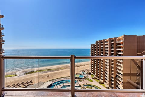 Amazing views from the large balcony; pools, beach, & ocean!