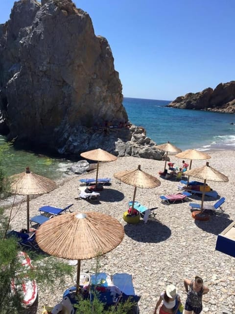 On the beach, sun loungers, beach umbrellas