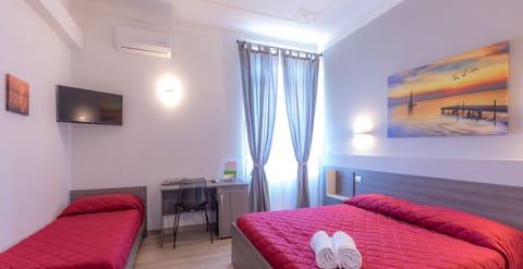 Triple Room | Minibar, in-room safe, desk, blackout drapes