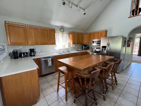 Fully equipped kitchen with air fryer, toaster, coffee makers, and all necessary utensils and appliances.
