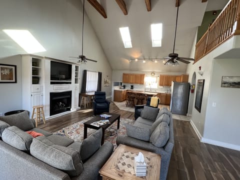 Living room--the couch facing the fireplace is a queen sleeper sofa.  The fireplace is gas burning.