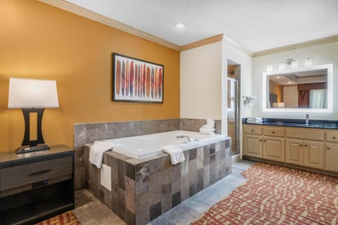 Suite, 1 King Bed, Non Smoking, Jetted Tub | Bathroom | Combined shower/tub, free toiletries, hair dryer, towels