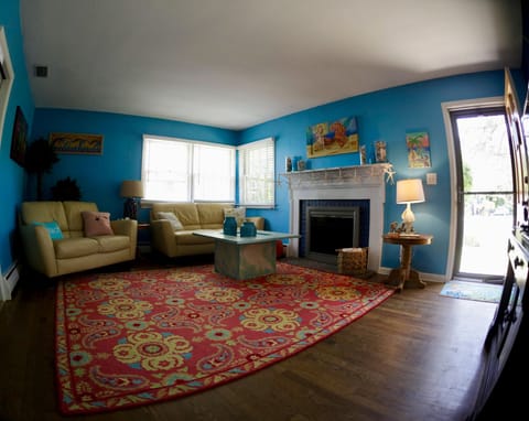 Living room has leather sofa and loveseat.