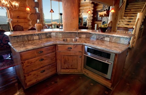 Kitchen island with wet bar and built-in microwave