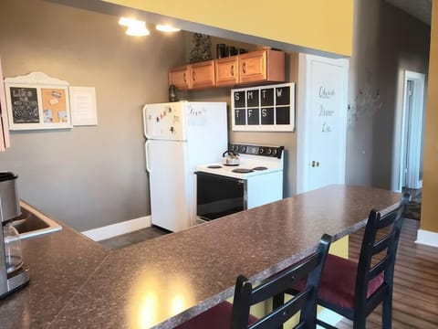Large bar area separates kitchen and dining room.