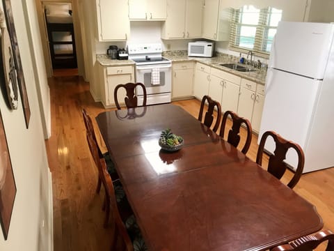 Dining Room is set up for 6 but the leaf is under the bunk bed for seating of 8.