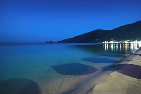 On the beach, sun loungers, beach umbrellas, rowing
