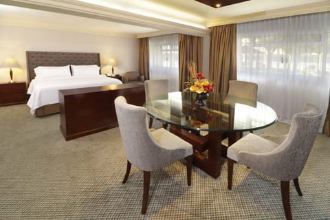 Suite, 1 King Bed | In-room safe, blackout drapes, iron/ironing board, cribs (free)