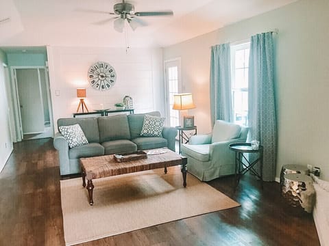 Enjoy an open, airy cottage feel...complete with shiplap and barnwood mantle.