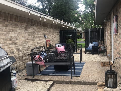 Relax in outdoor oasis with grill and fire pit