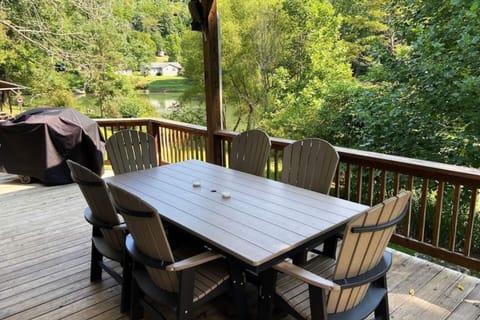 Incredible outdoor living and dining area. Seat ten for dinner. Watch the children enjoying the river.