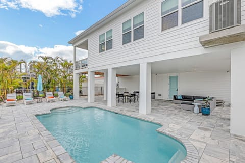 Back of the Home sits on a canal
resort like grounds - open pool -seating 