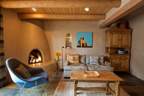 Living room, with gas-fired Kiva fireplace and down-filled soft. 